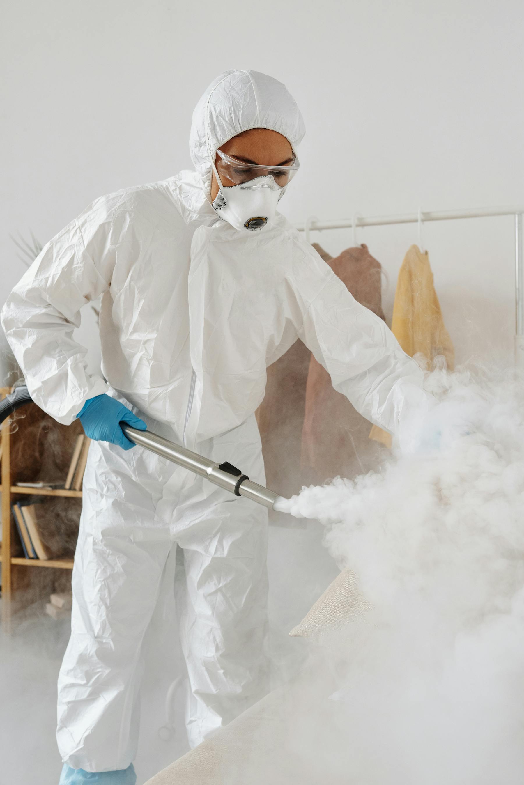 Protective-suit technician performing Rochester crime scene cleanup